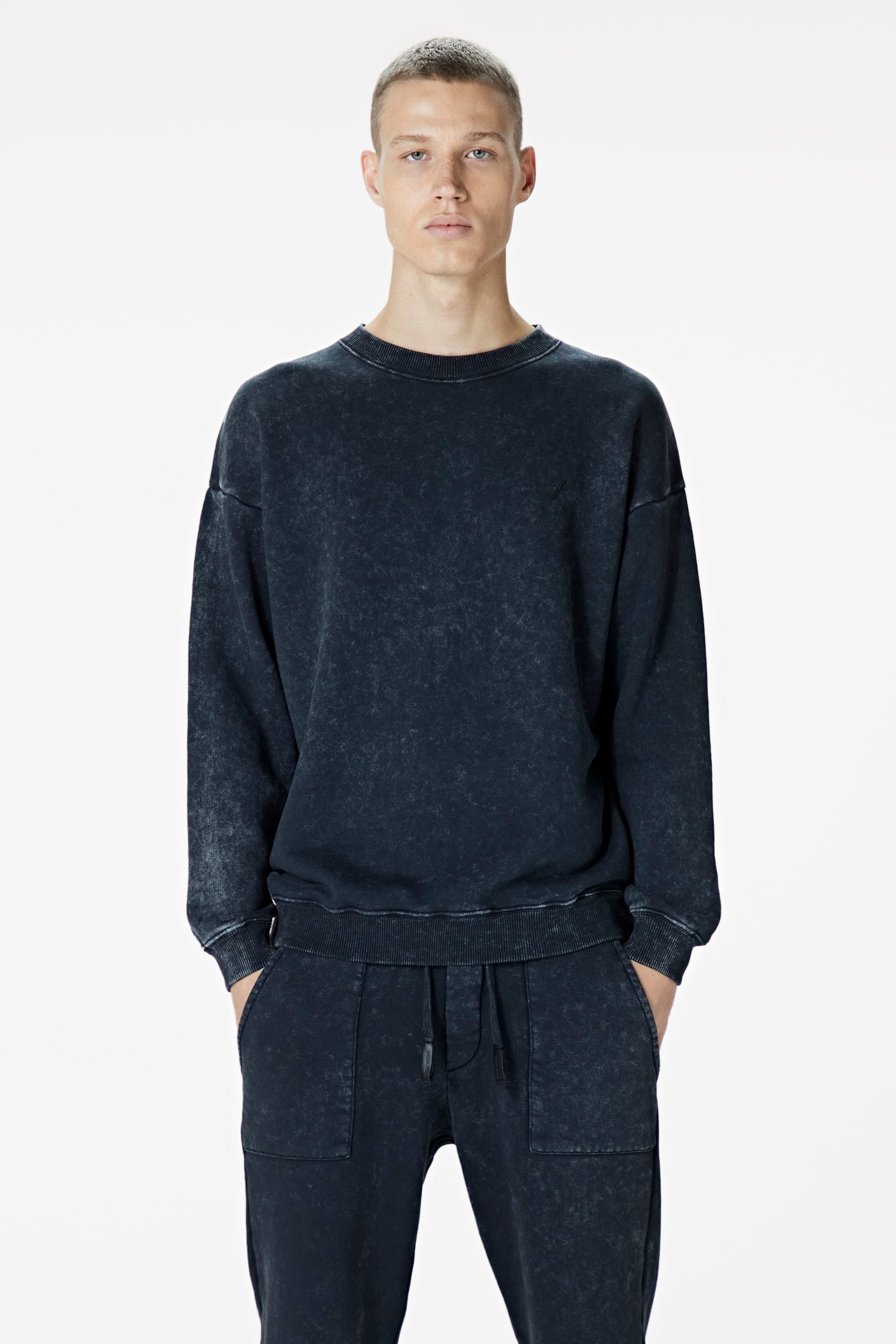 Male Model wearing black washed sweatshirt - BODA SKINS. front facing