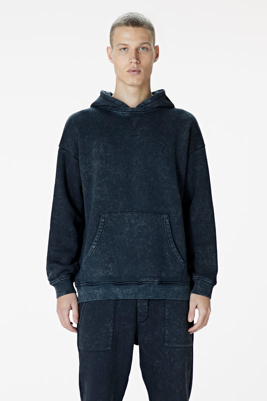 Male Model wearing black washed hoodie - BODA SKINS. front facing